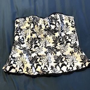 Strapless top with black and white embroidered overlay